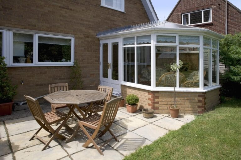conservatory with white upvc panels and glass roof